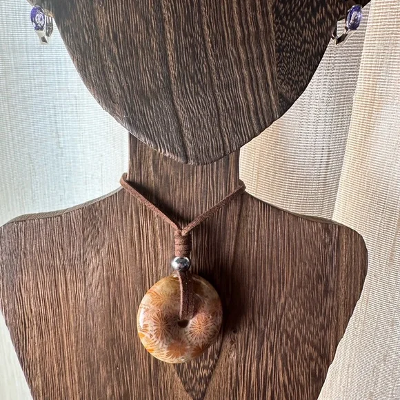 Light Yellow Coral Fossil Donut Pendant Necklace on Brown Faux Suede - Picture 4 of 11